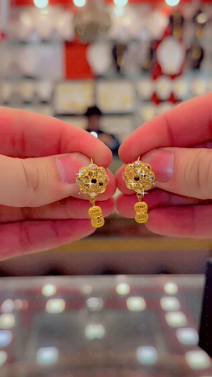 Intricate Gold Jhumka Earrings with Floral Top and Sparkling Accents