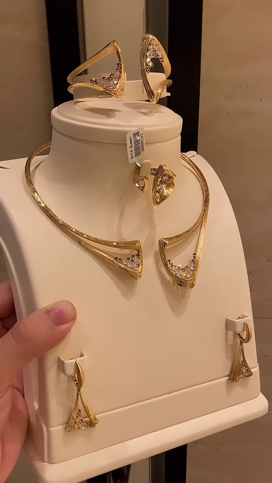 Modern Gold-Toned Jewelry Set with Geometric Cutouts and Crystal Accents – Necklace, Bracelet, Ring, Earrings